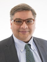 Headshot of Adolph P. Falcón, MPP