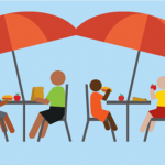 People seated outside eating