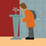 A student drinking from a water fountain