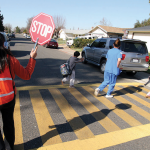 Children and adults in a school crosswalk