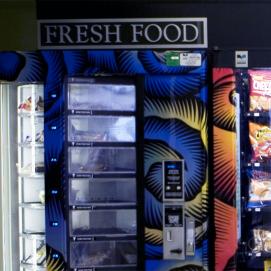Vending machines with an assortment of chips and soda
