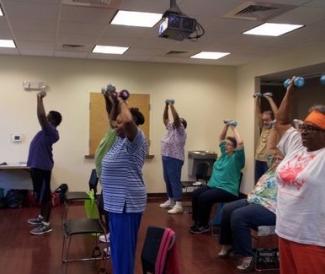 First Missionary Baptist Church congregants exercising 