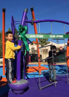 A child at the opening of the Avalon Park playground