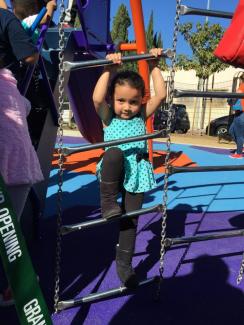 A small child on a ladder at Avalon Park playground
