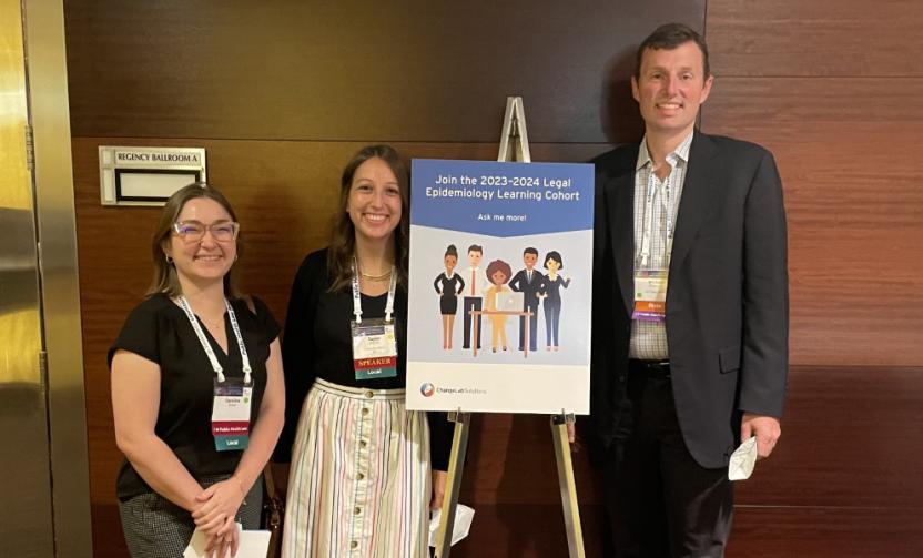 Past Participants from CDC and ChangeLab's legal epi learning cohort pose next to a sign.